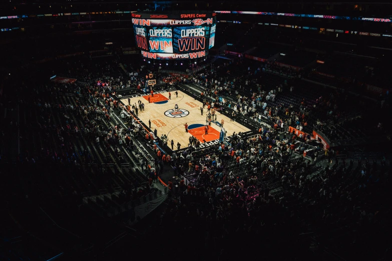 fans at a sports game are watching and playing