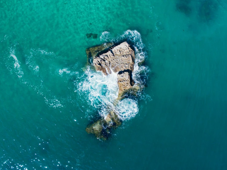 an aerial view of the shore and sea