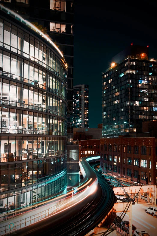 a city skyline with light streaks on the buildings