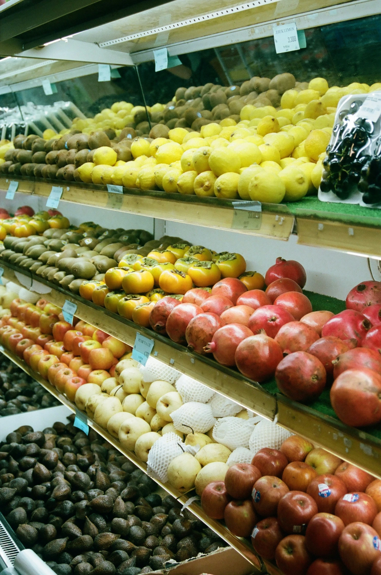 a display at a grocery store filled with lots of apples