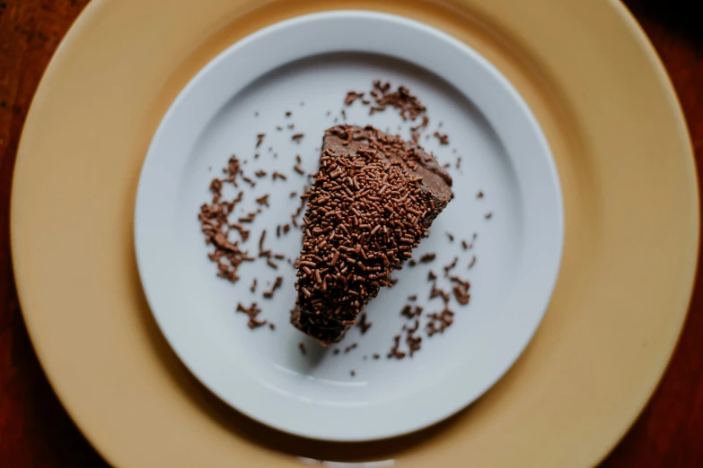 a plate with a piece of chocolate dessert on it