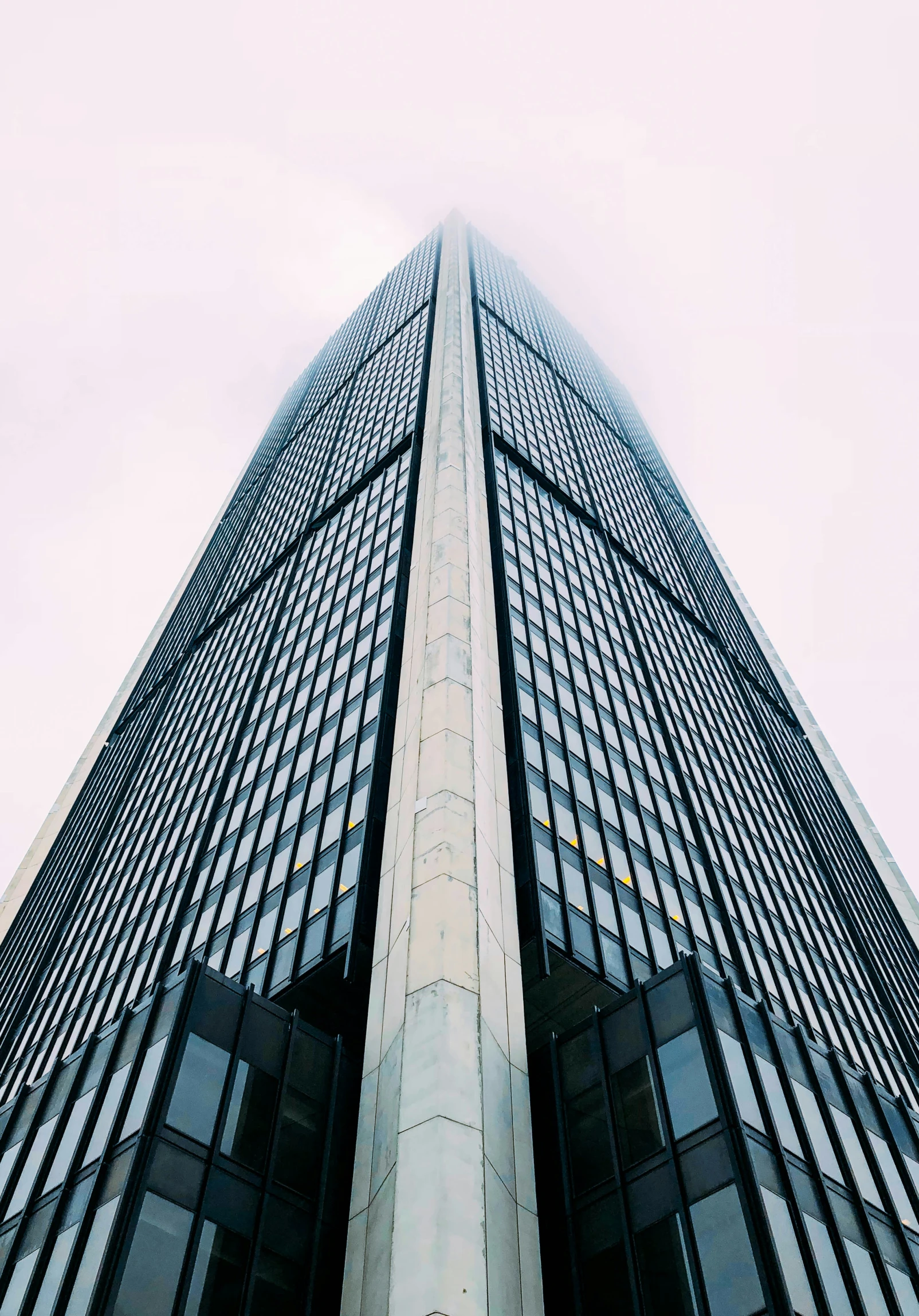 looking up at the top of a building from below