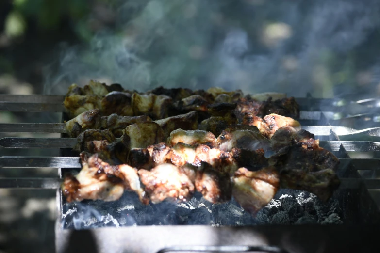 there is food cooking on the grill being cooked