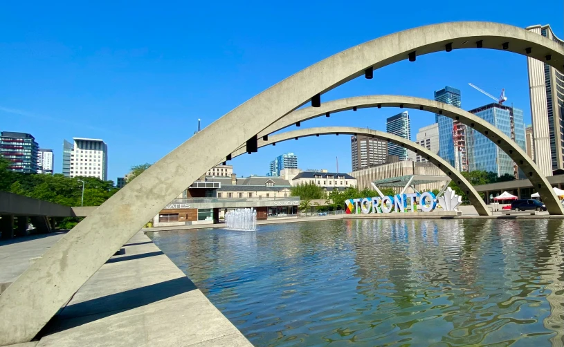 a large body of water in front of tall buildings