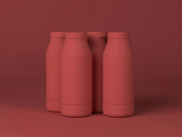 three empty red vases lined up on pink backdrop