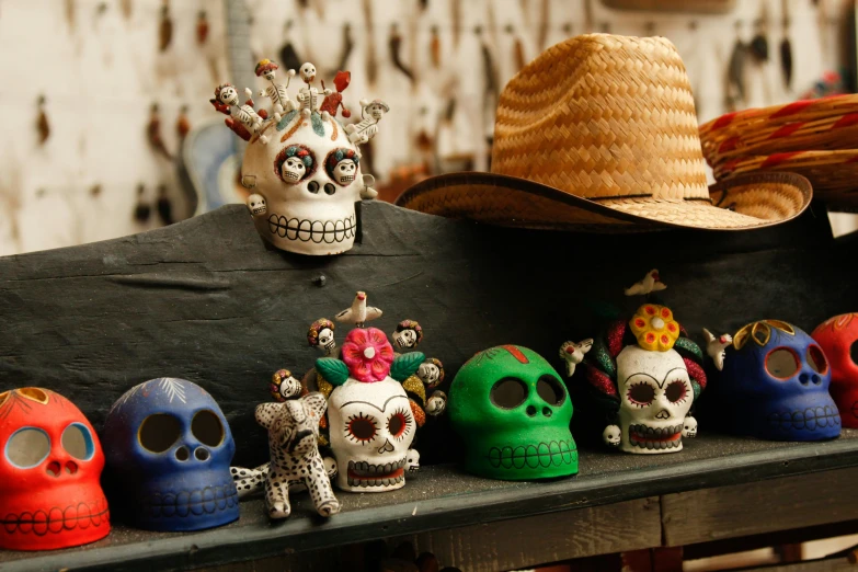 many different colored skull figurines on a table