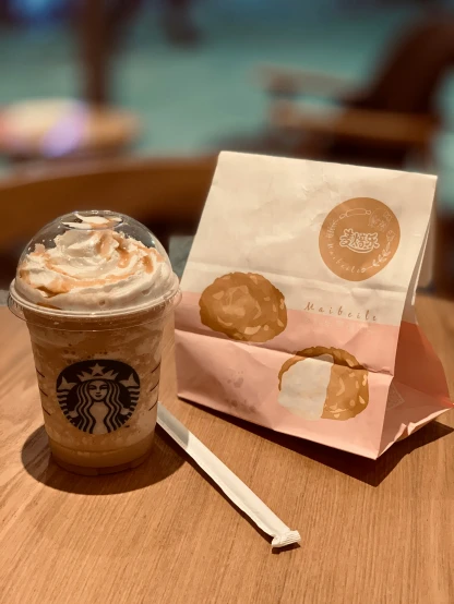 a starbucks coffee and donut from starbucks