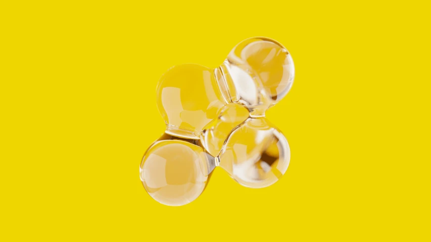 three glass orbs floating in yellow water