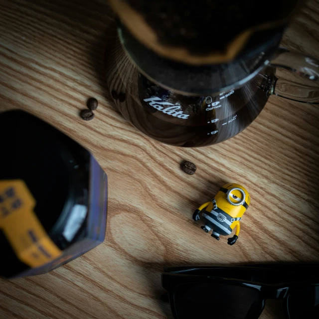 a toy car and sunglasses on a table