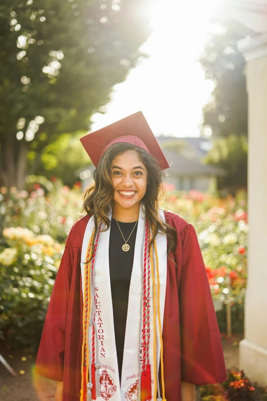 a person in a cap and gown is standing