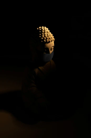 an illuminated small toy sitting in the dark