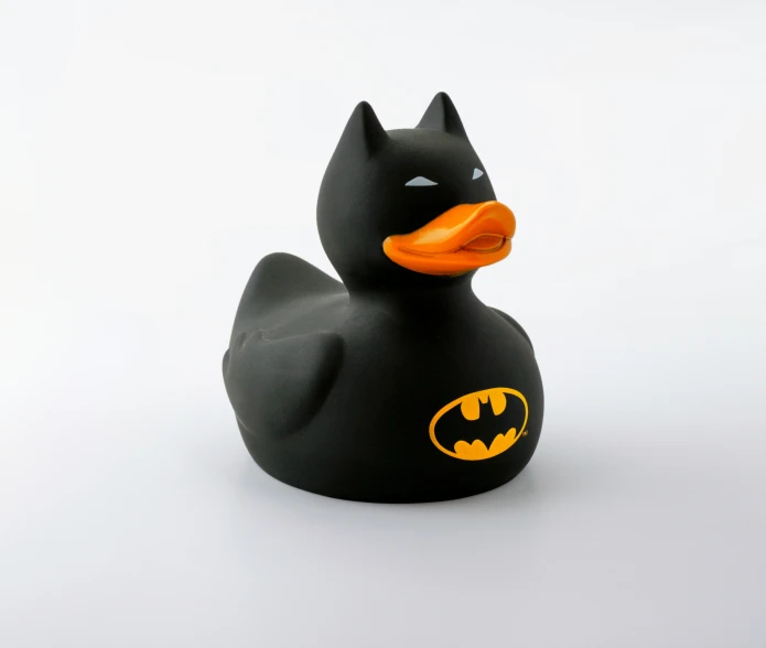 a rubber duck is holding an orange collar
