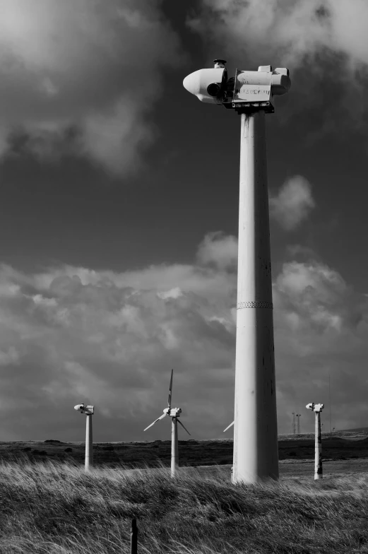 black and white po of a wind turbine in an open field