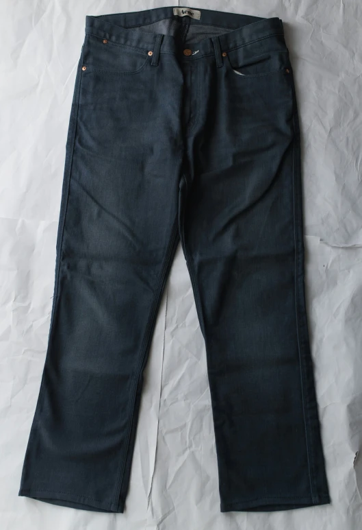 an old pair of dark blue jeans that are worn