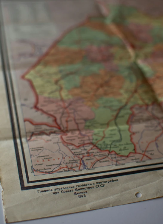 a map lying on top of a white surface