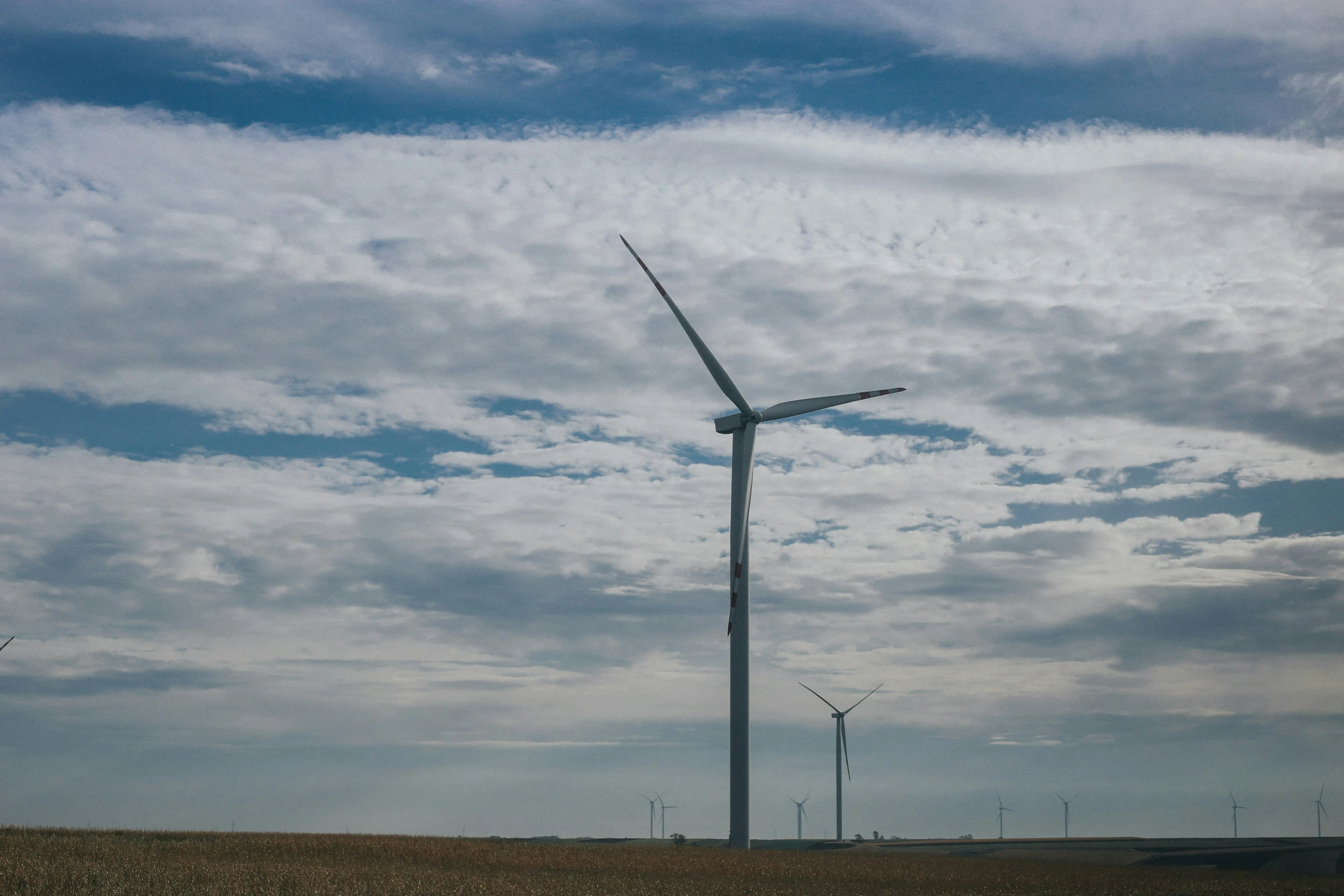 a view of a windmill on a cloudy day