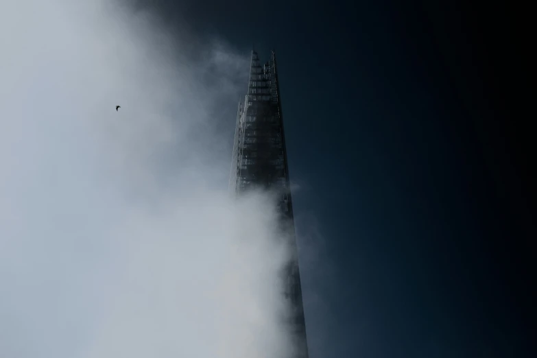 a very tall tower with a sky background