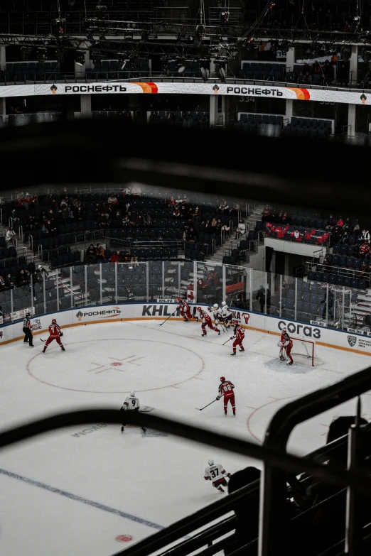 a group of people playing a game of hockey