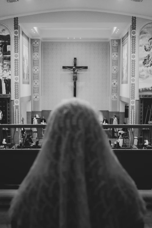 a black and white po of a cross in a church