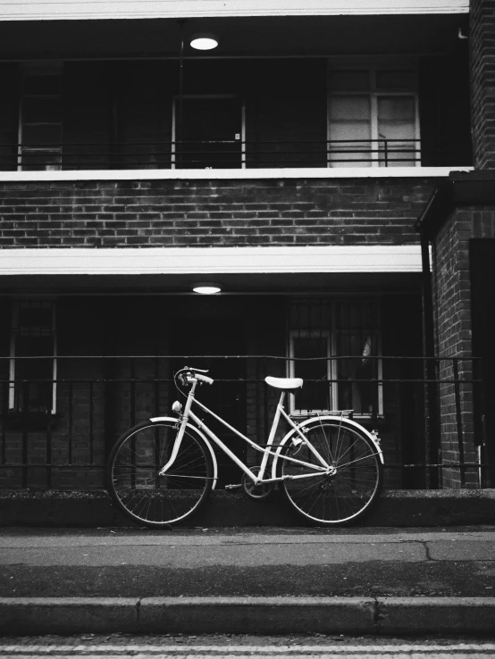 a bike parked in front of a brick building