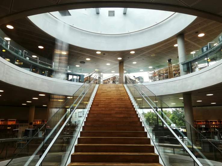 a big building with lots of windows next to some stairs