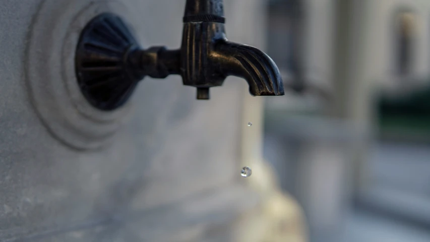 a faucet with water being poured onto it