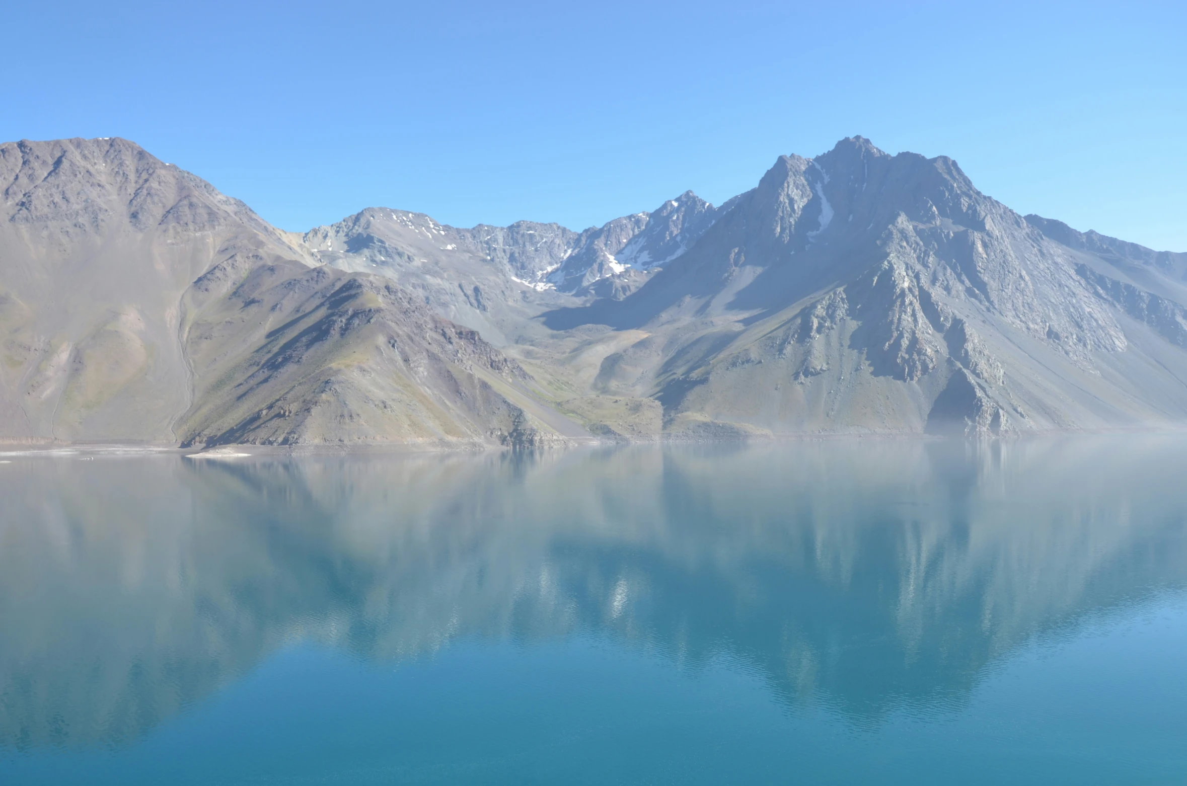 this is an image of a body of water with mountains in the background