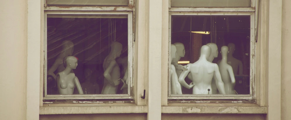 a picture of people standing outside of a window