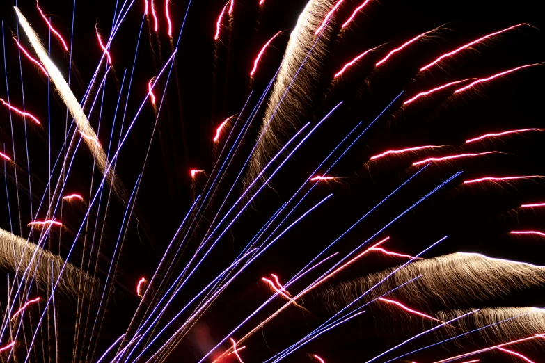 fireworks with multiple trails of light streaks in them