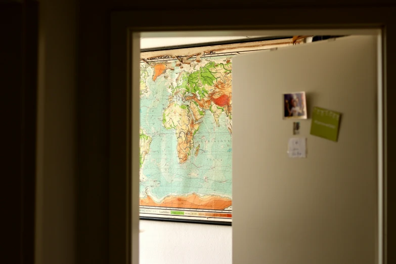 a view into an open door to a map
