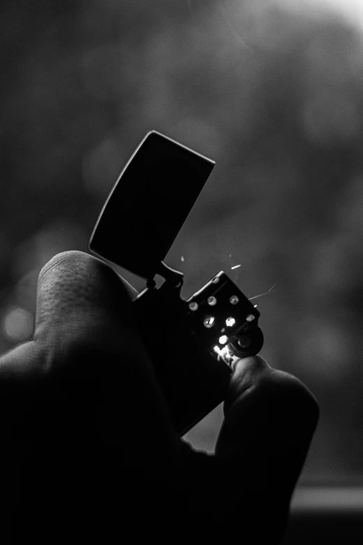 a black and white po shows the guitar in someones hand