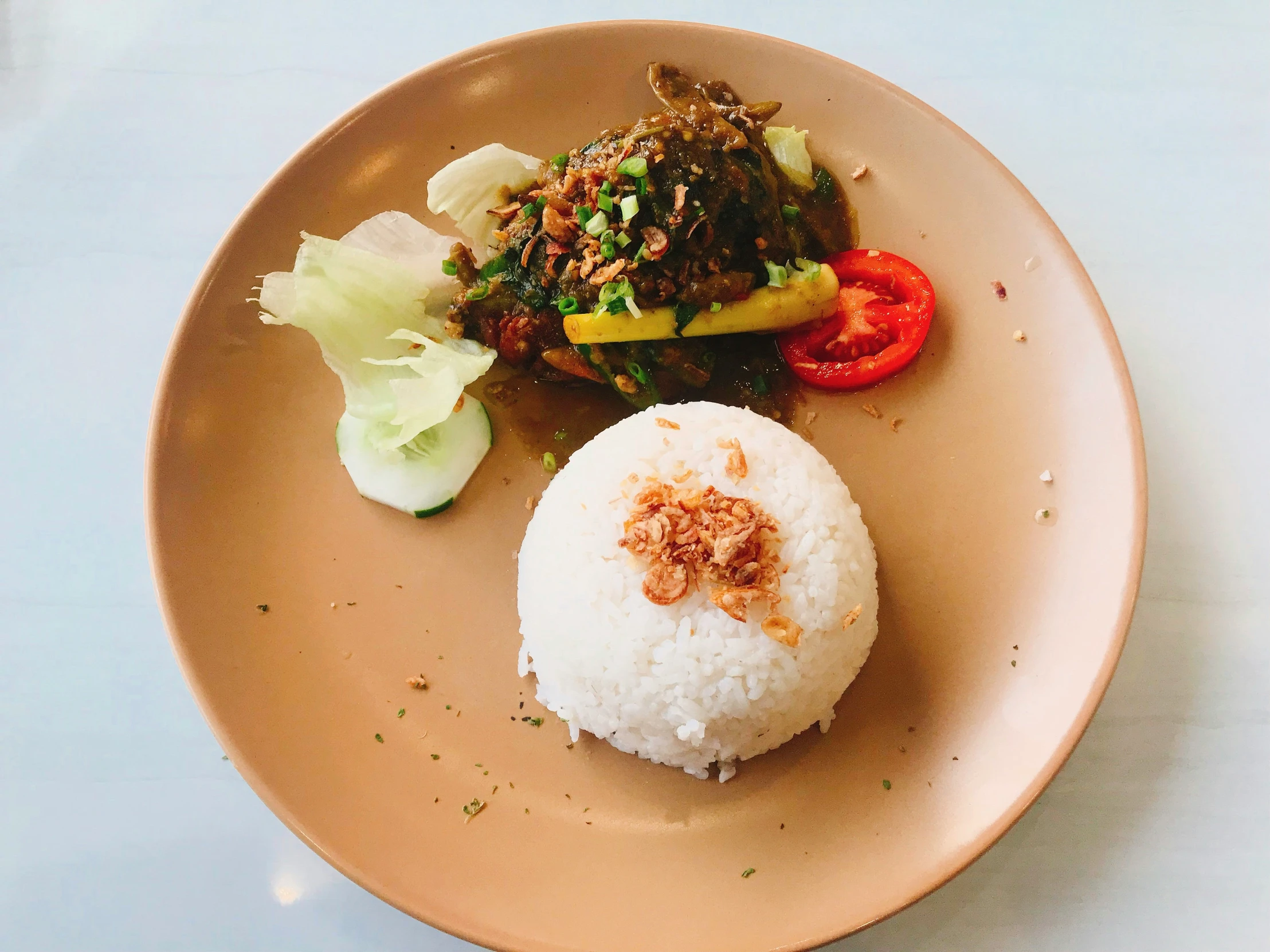 a bowl with rice and vegetables on it