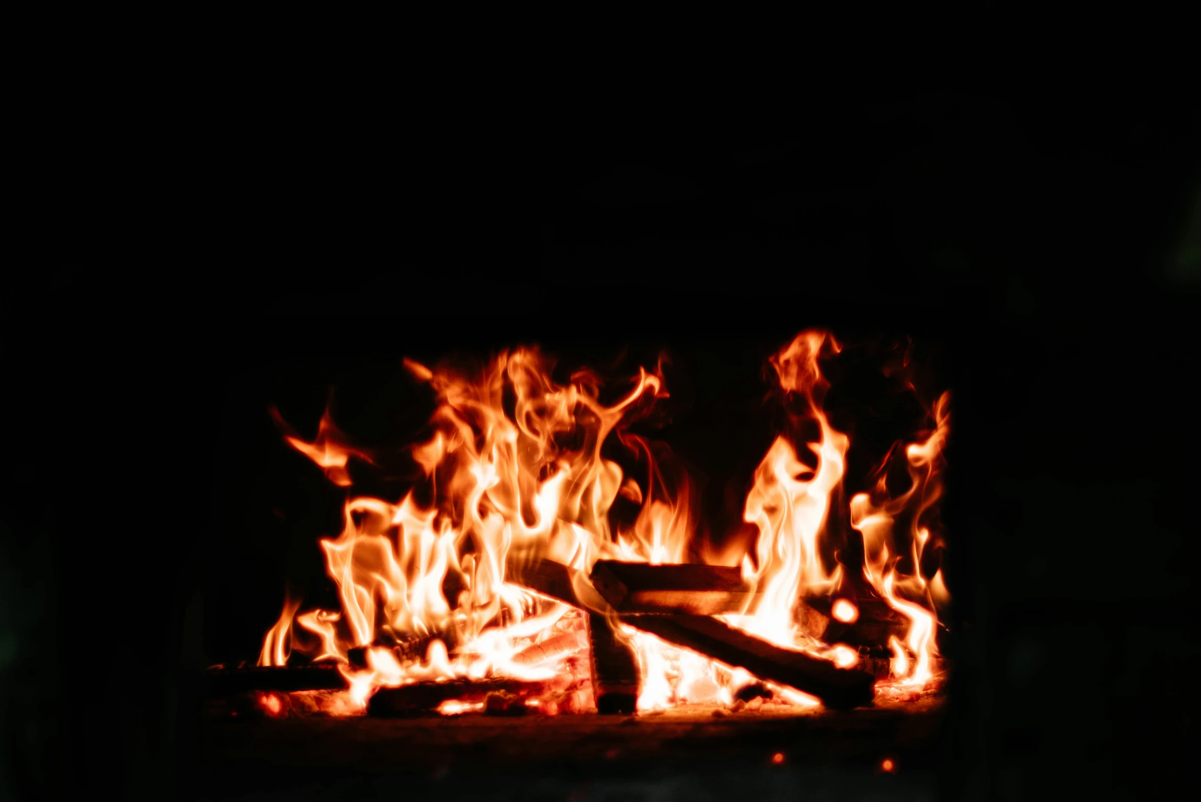 a fire burning brightly in the dark