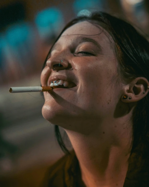 a woman is smoking a cigarette with her mouth open