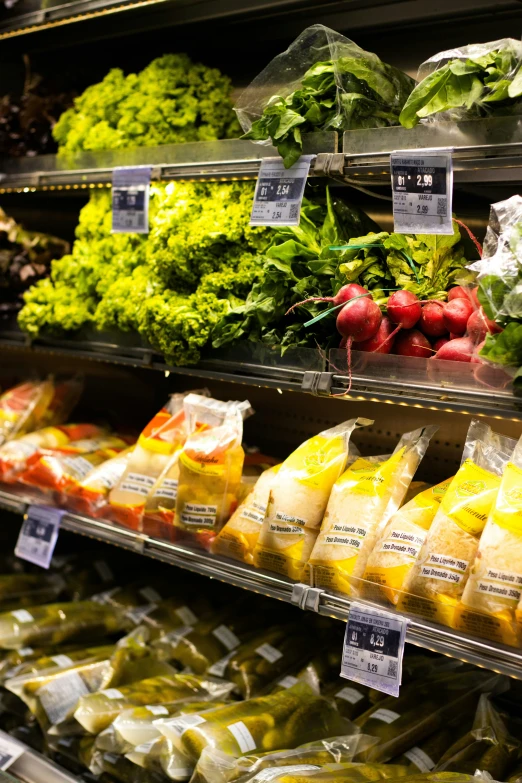 various vegetables on shelves in a grocery store