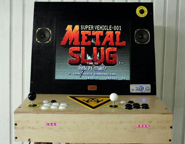 a metal slug arcade machine sitting on top of a table