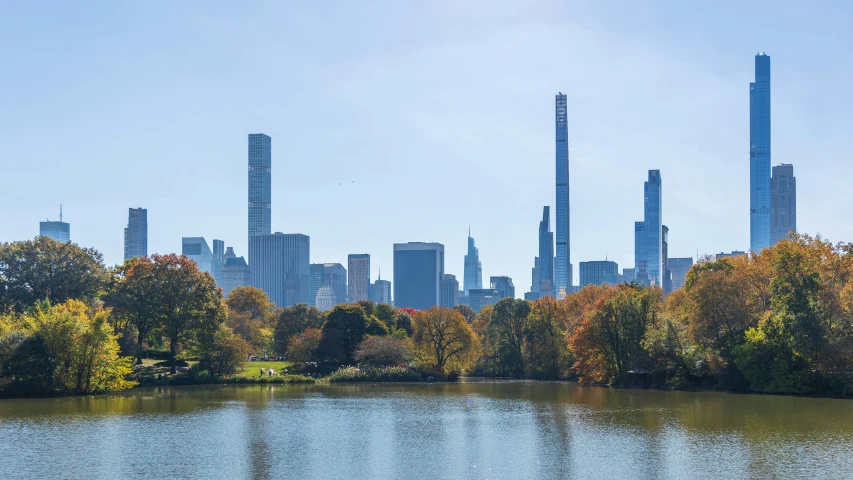 a body of water in front of a city with tall buildings