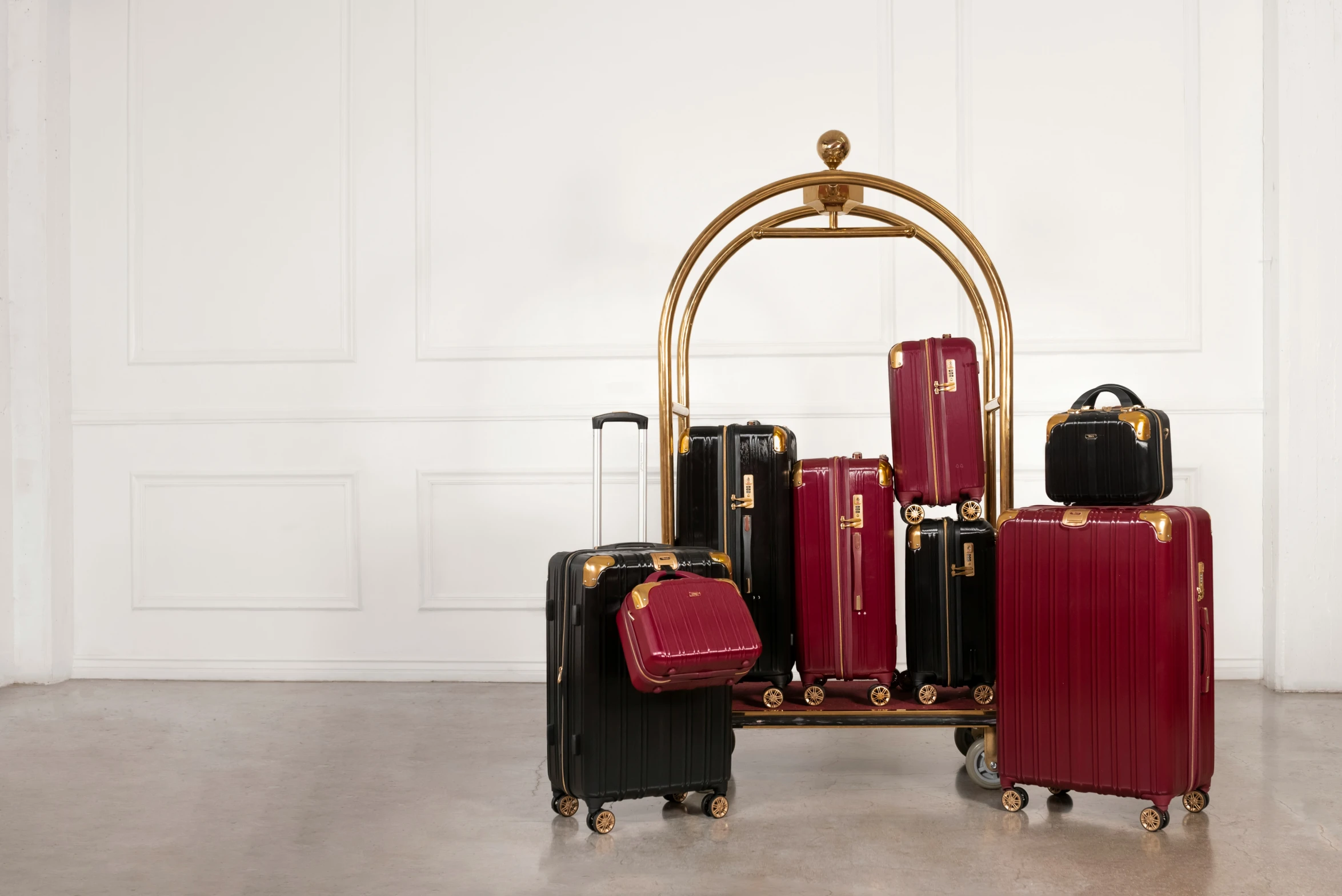 a display of various suitcases in a white room