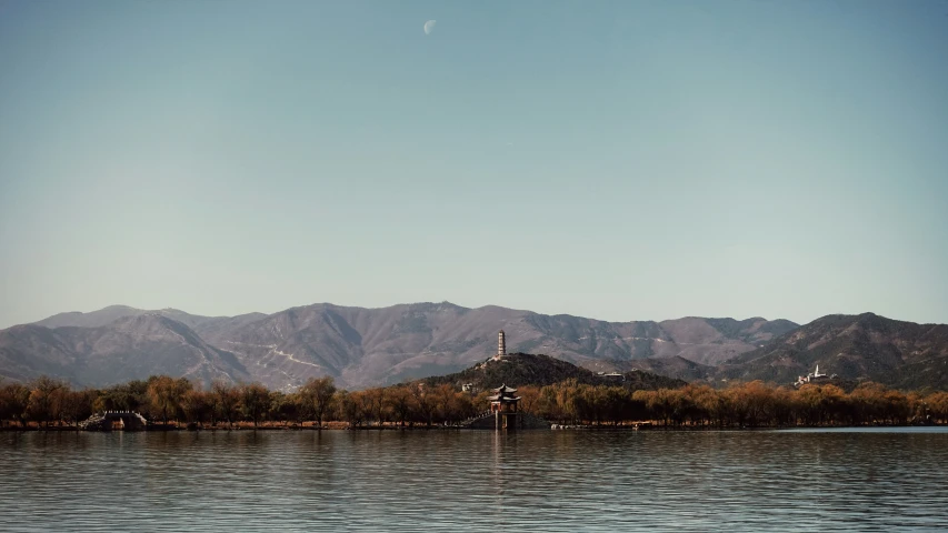 a couple of boats floating across a river