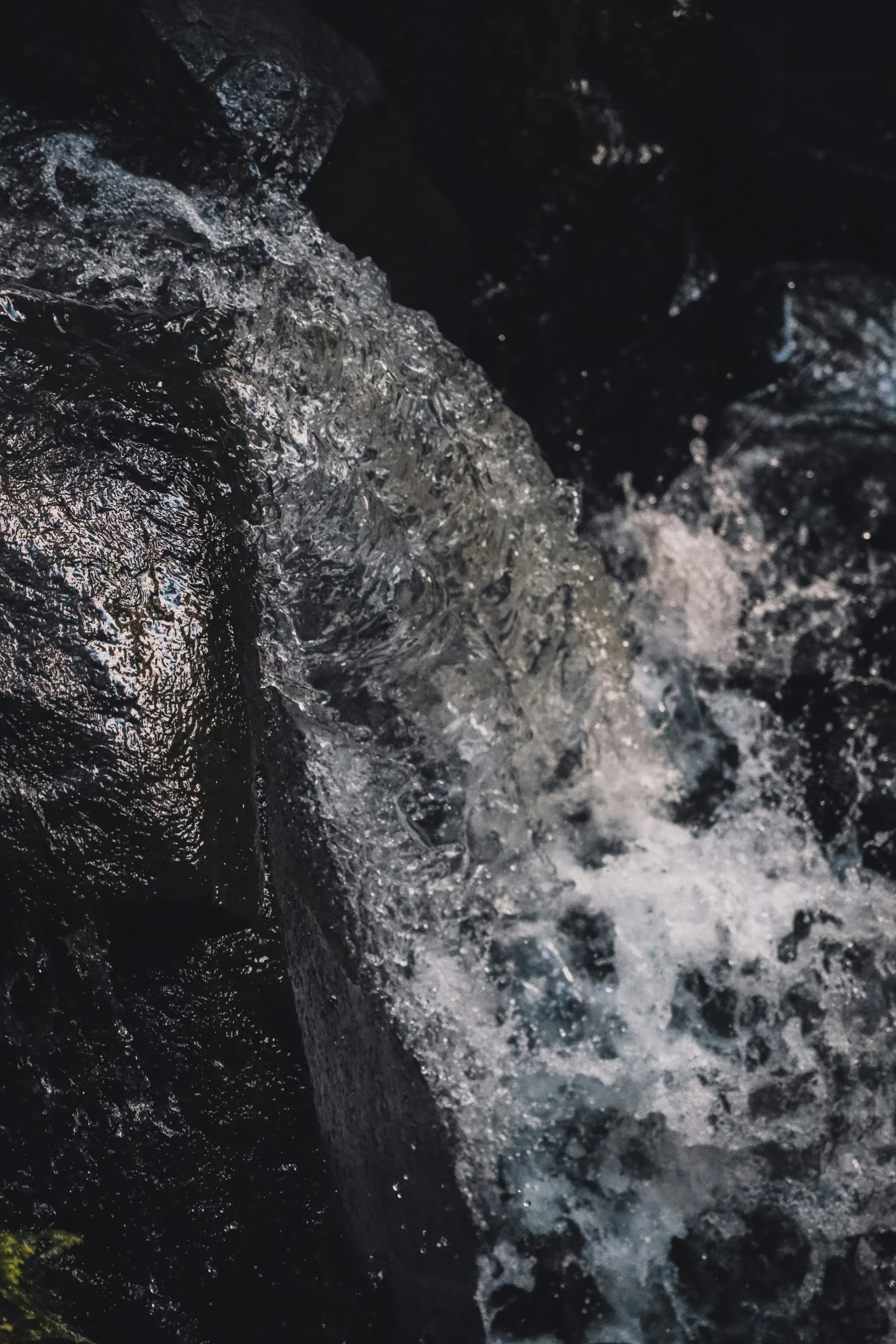 a water skier looking down at some large rocks