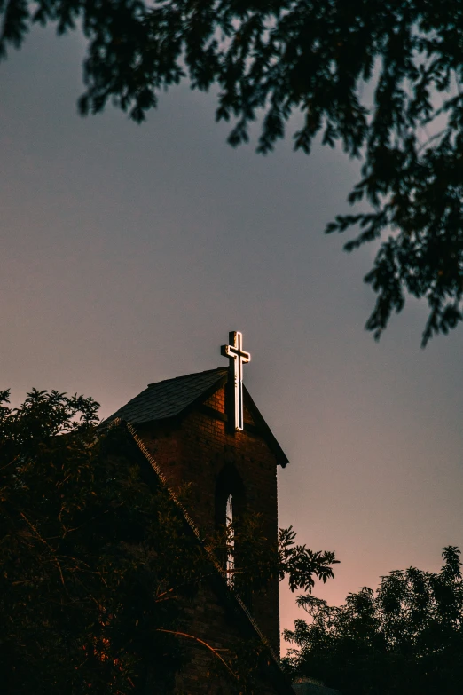 a large church building with a cross on it's roof