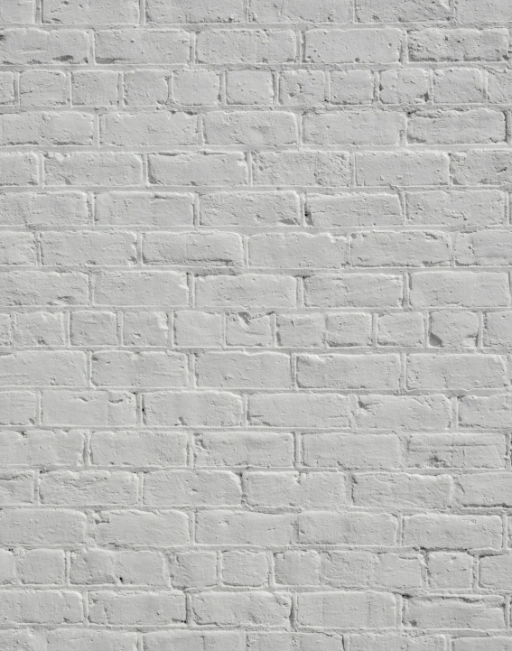 a white brick wall made of several small tiles