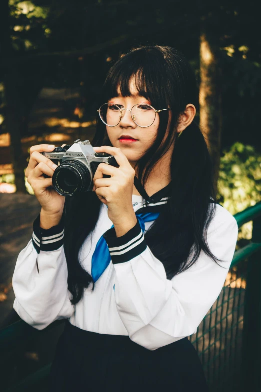 a woman takes a picture in her school uniform