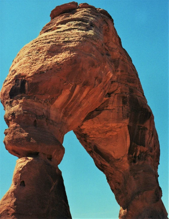 an arch in a rocky area in the desert