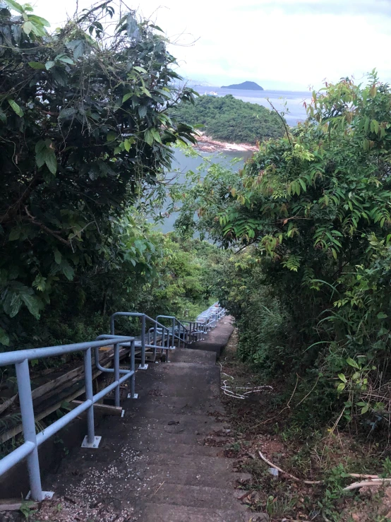 stairs leading to the water on a cloudy day