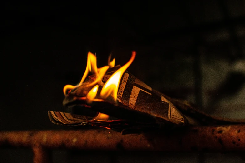 a burning book sitting on top of a table