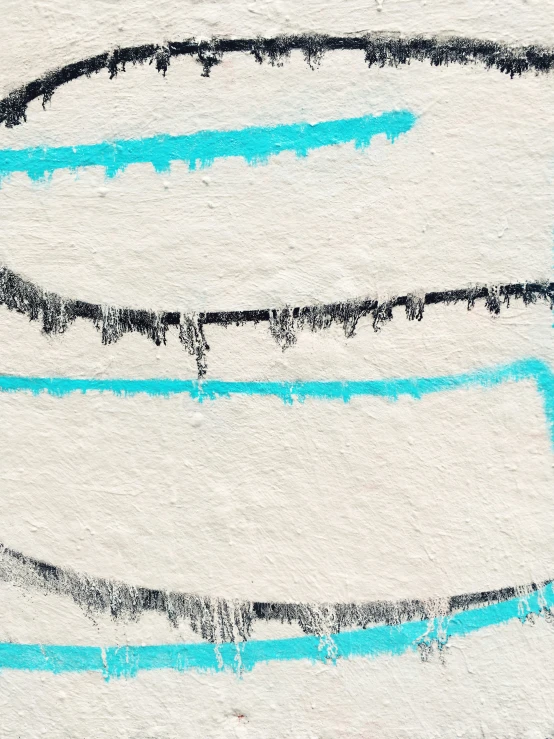 a blue and black painting on a white surface