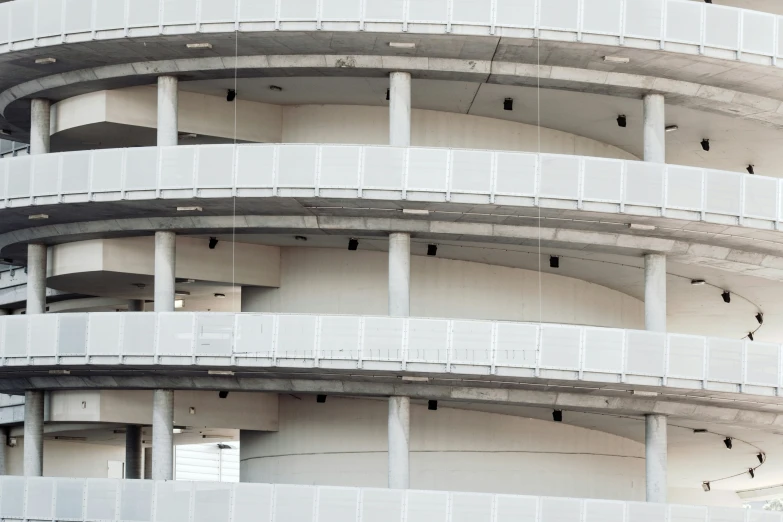 an apartment building with several balconies at the upper level