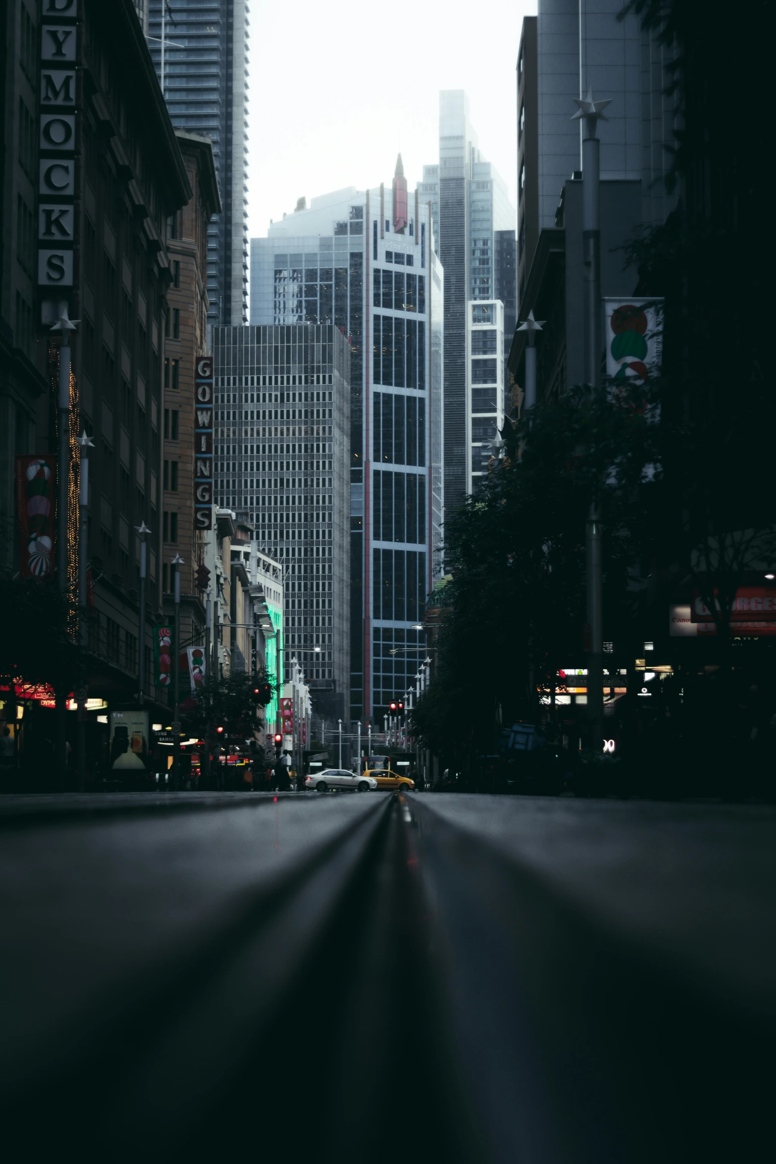 there is a street lined with large buildings