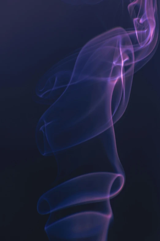 the purple smoke is floating by itself on a dark background